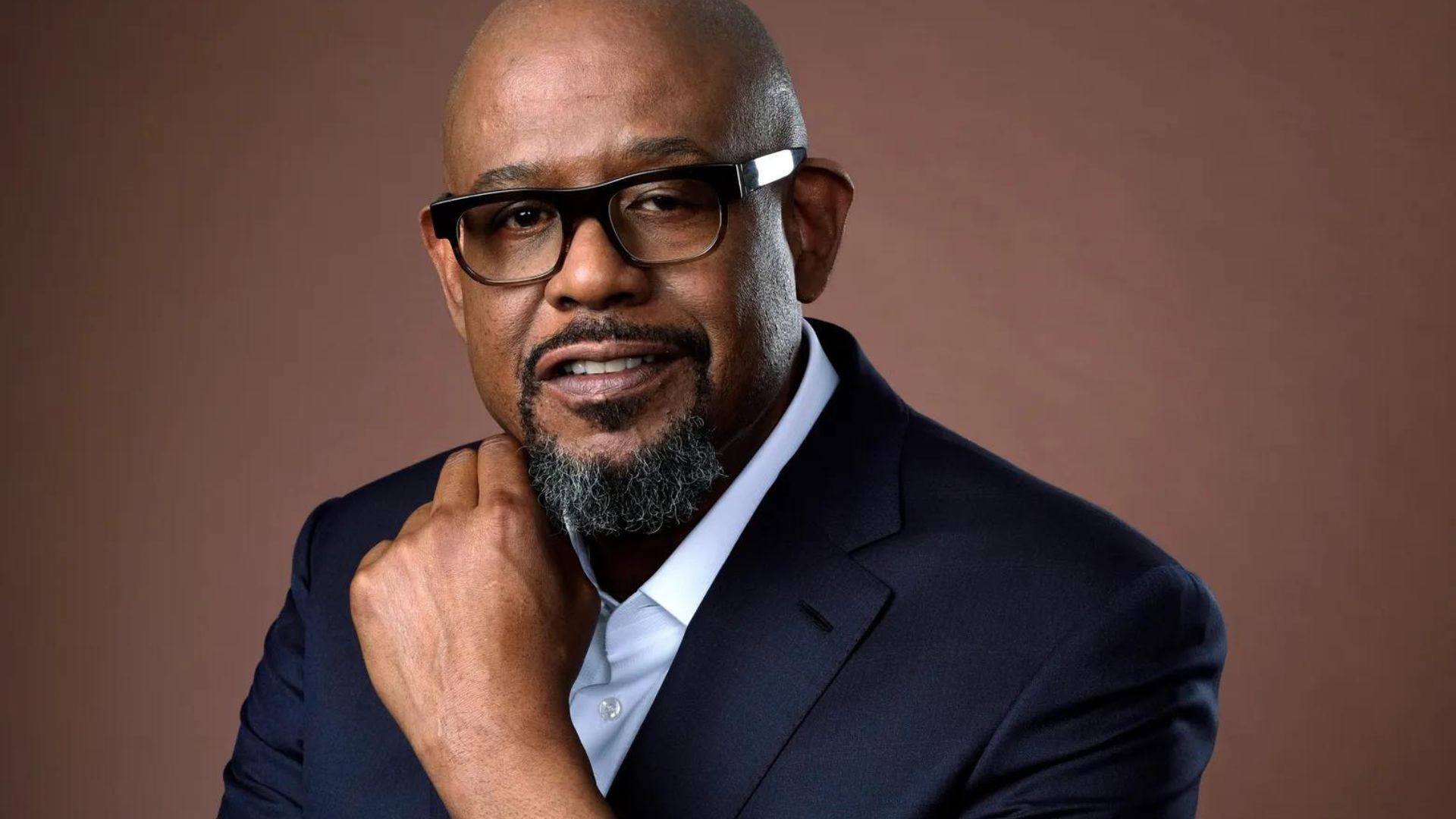Forest Whitaker Wearing Blue Suit And Eyeglasses
