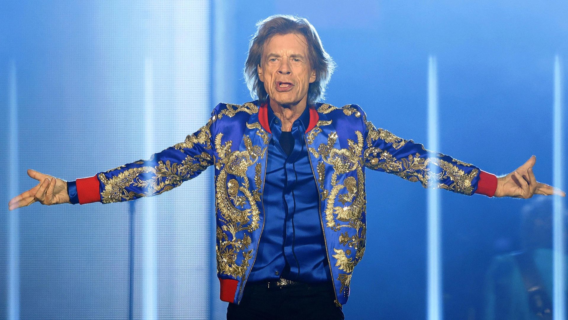 Mick Jagger Wearing A Blue With Gold Accent Coat