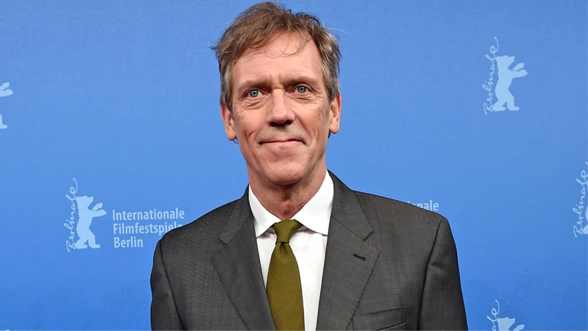 Hugh Laurie Standing In Formal Clothing