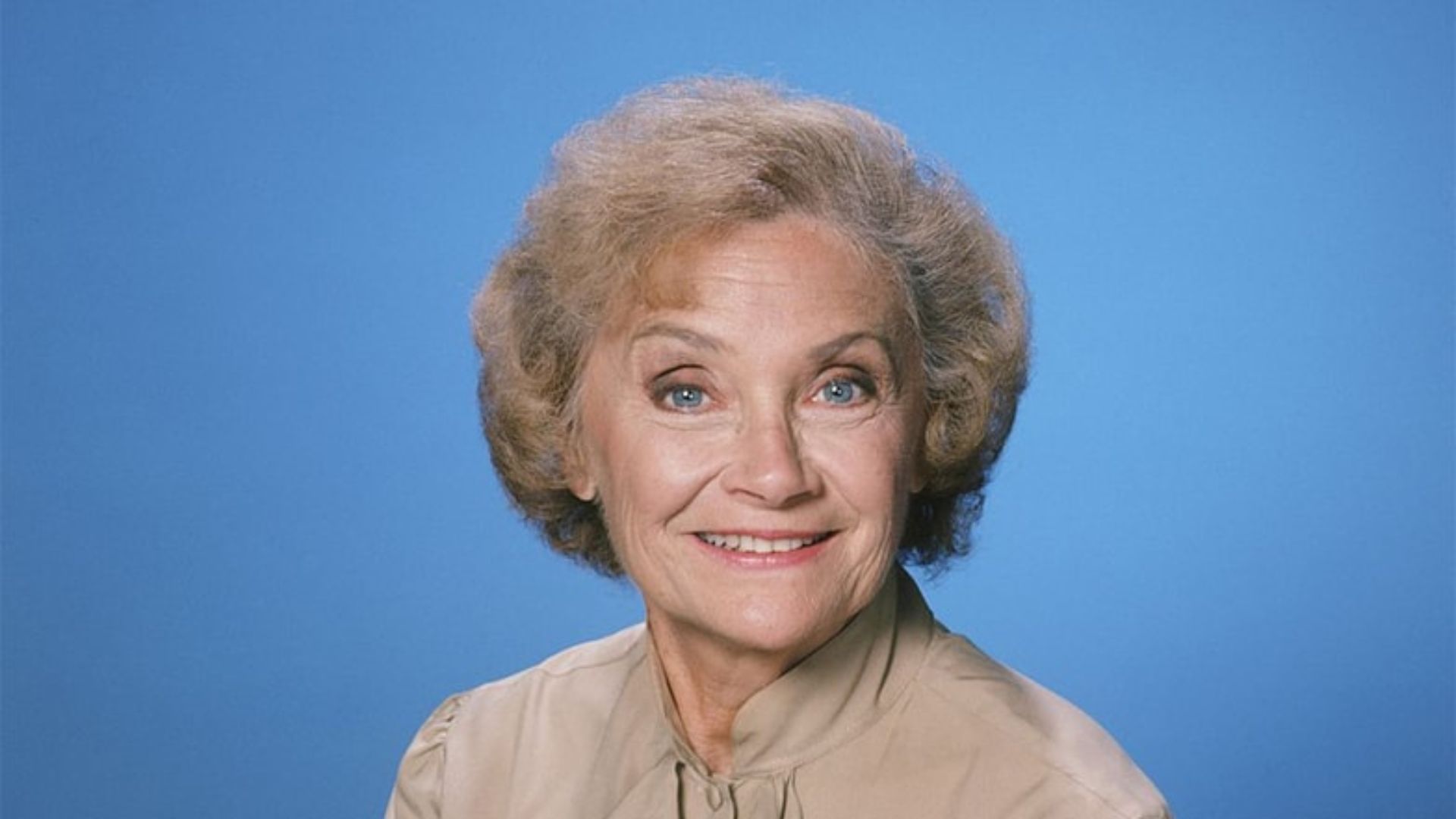 Estelle Getty Smiling And Wearing Brown Dress