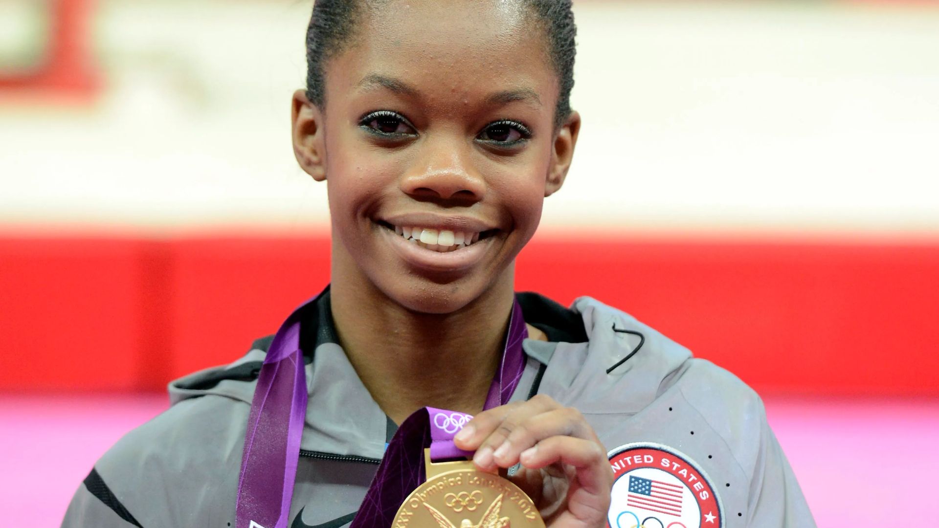 Gabby Douglas Showing Off Her Medals
