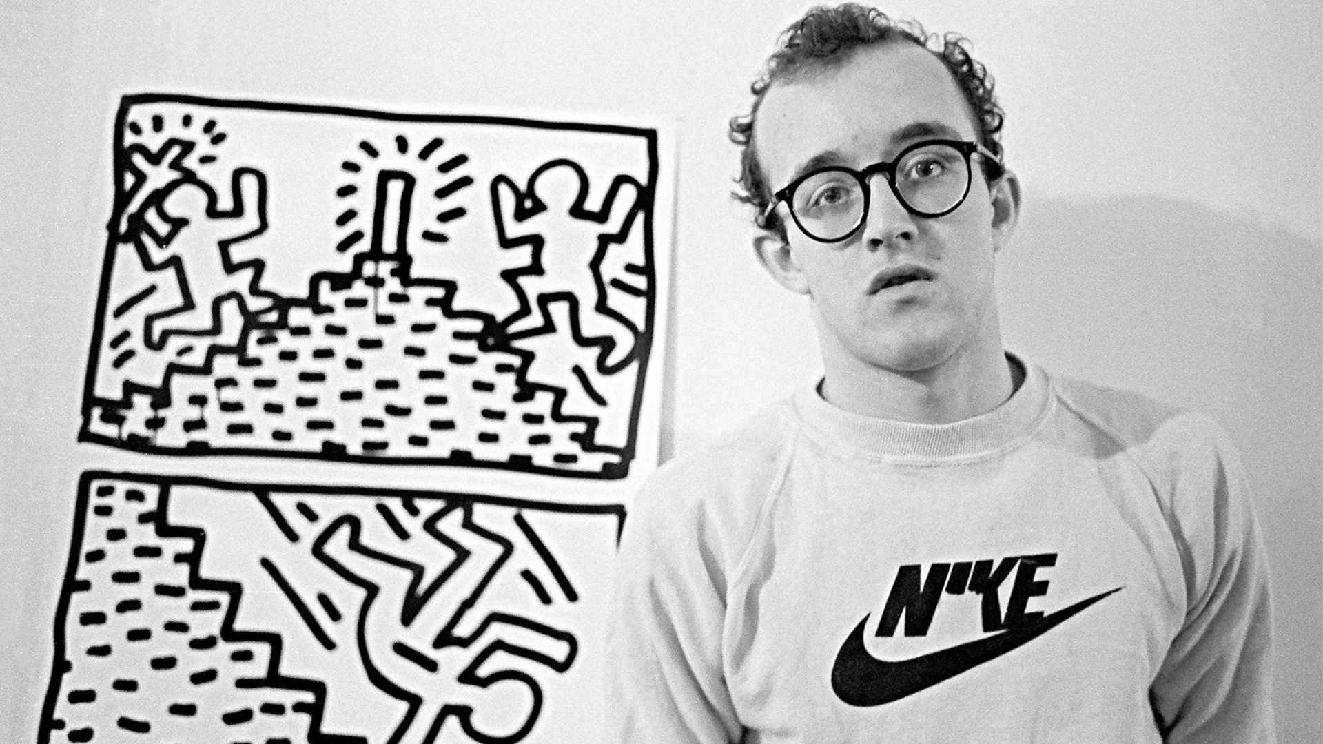 Keith Haring Standing Next To Painting