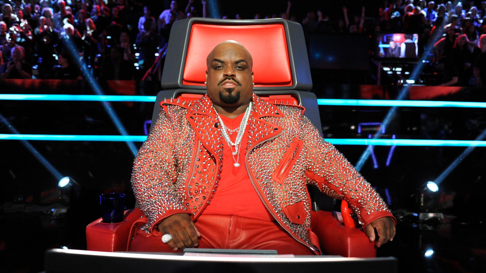 CeeLo Green Sitting On A Big Red Chair