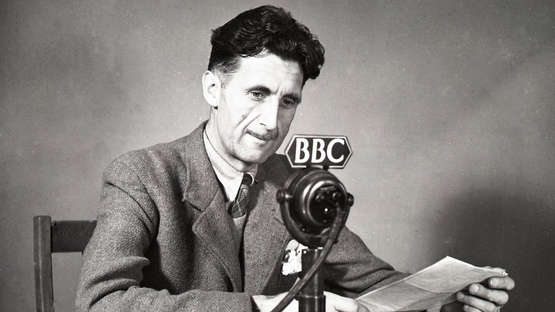 George Orwell Holding Papers And Speaking In Mic Labeled BBC