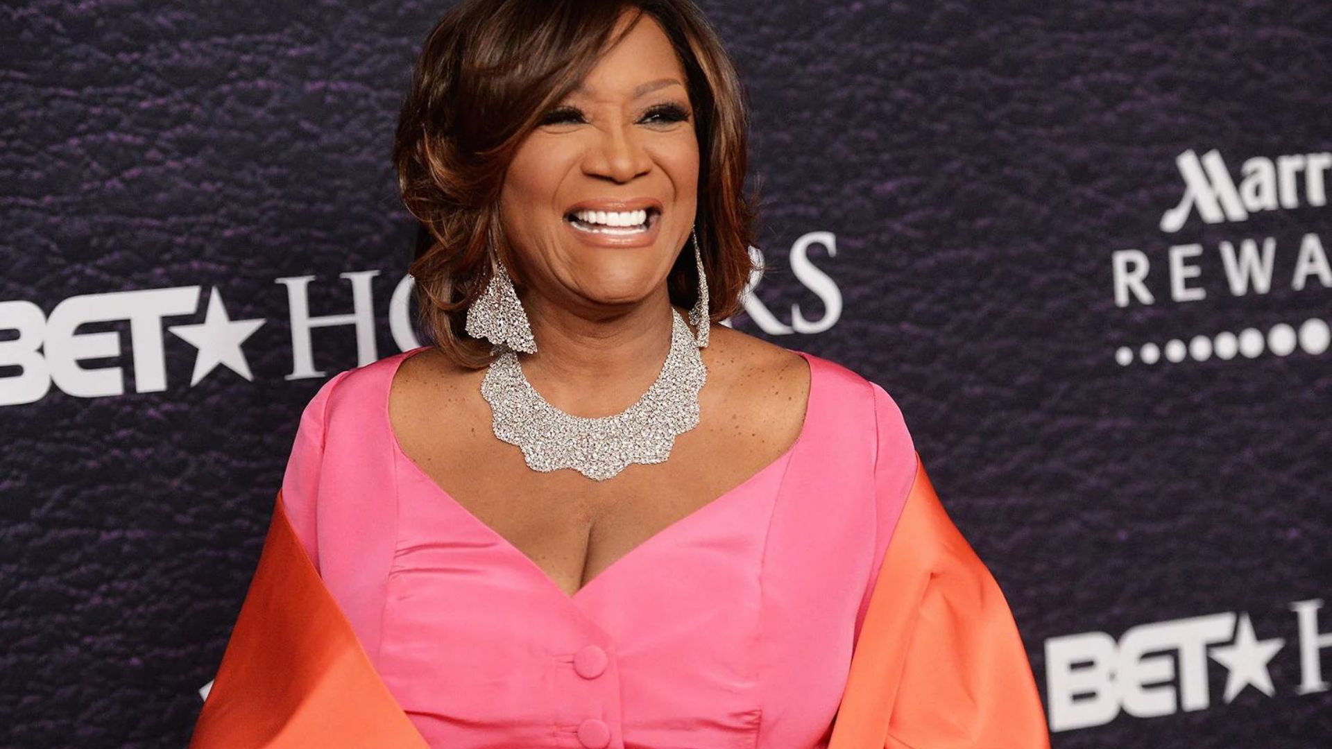Patti LaBelle Smiling And Wearing Pink Dess