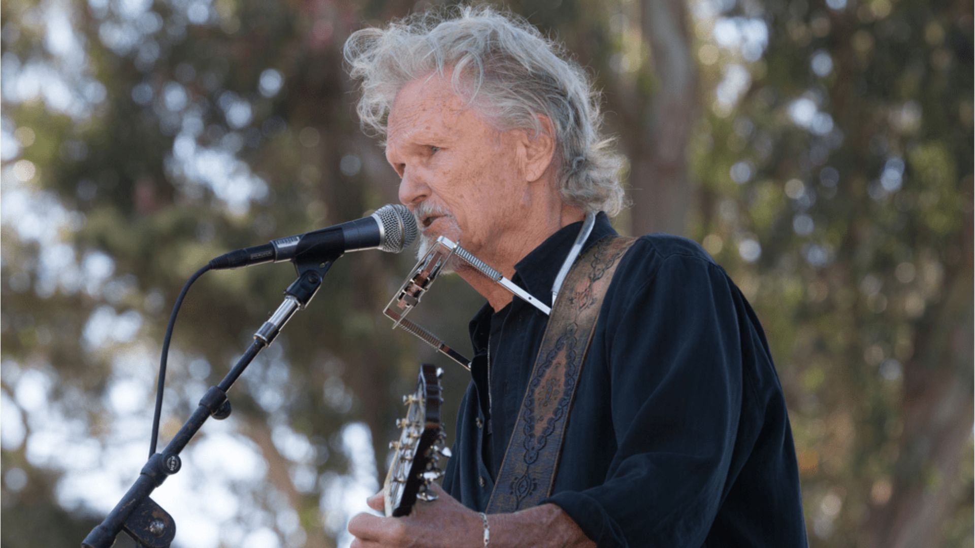 Kris Kristofferson Performing With His Guitar