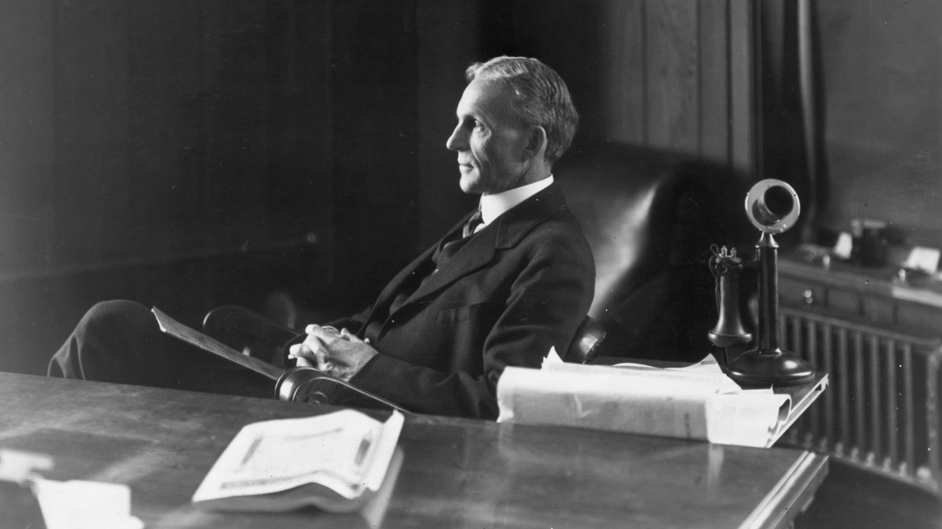 Henry Ford Sitting On A Seat