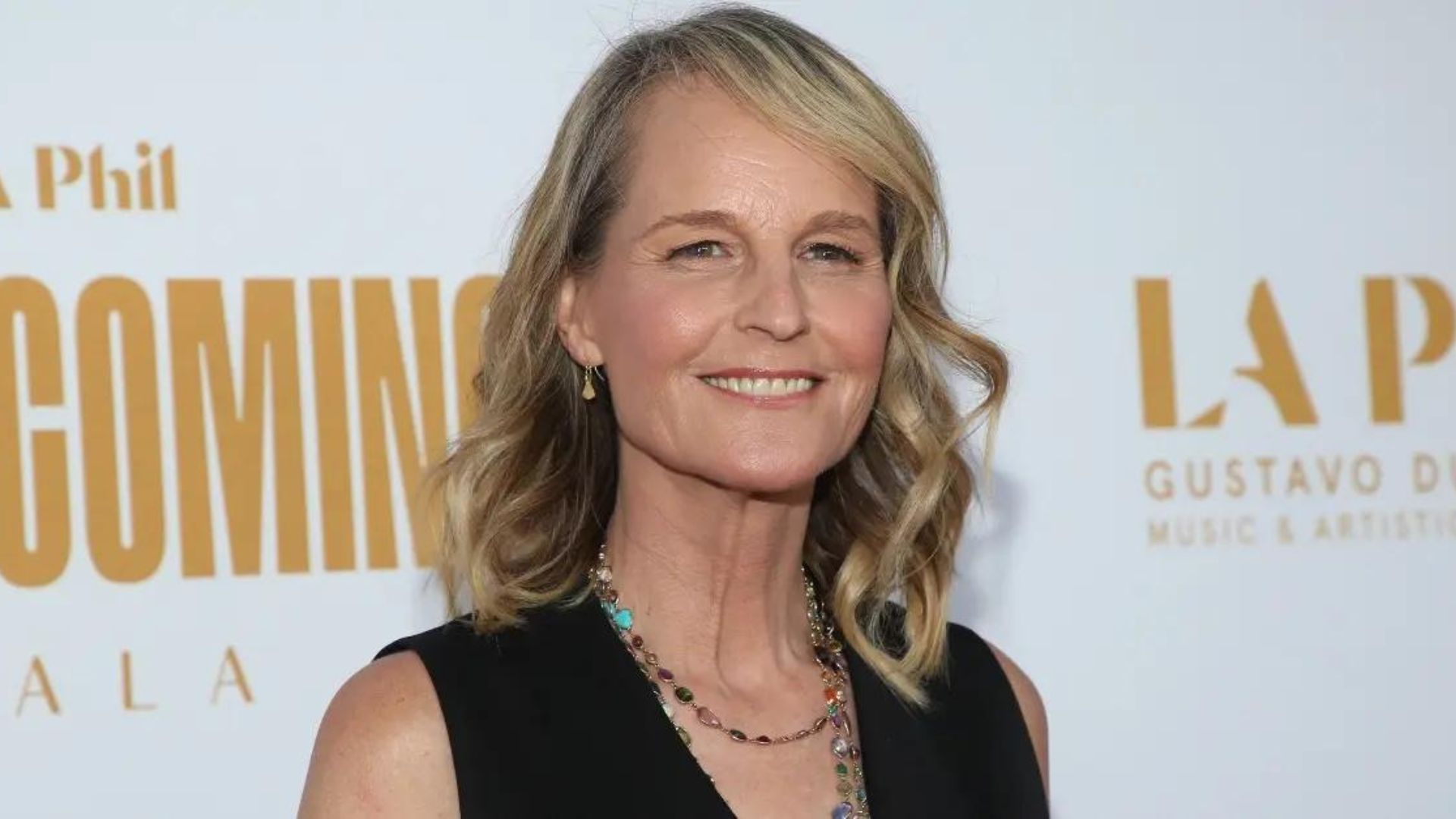 Helen Hunt Smiling And White Poster In Background