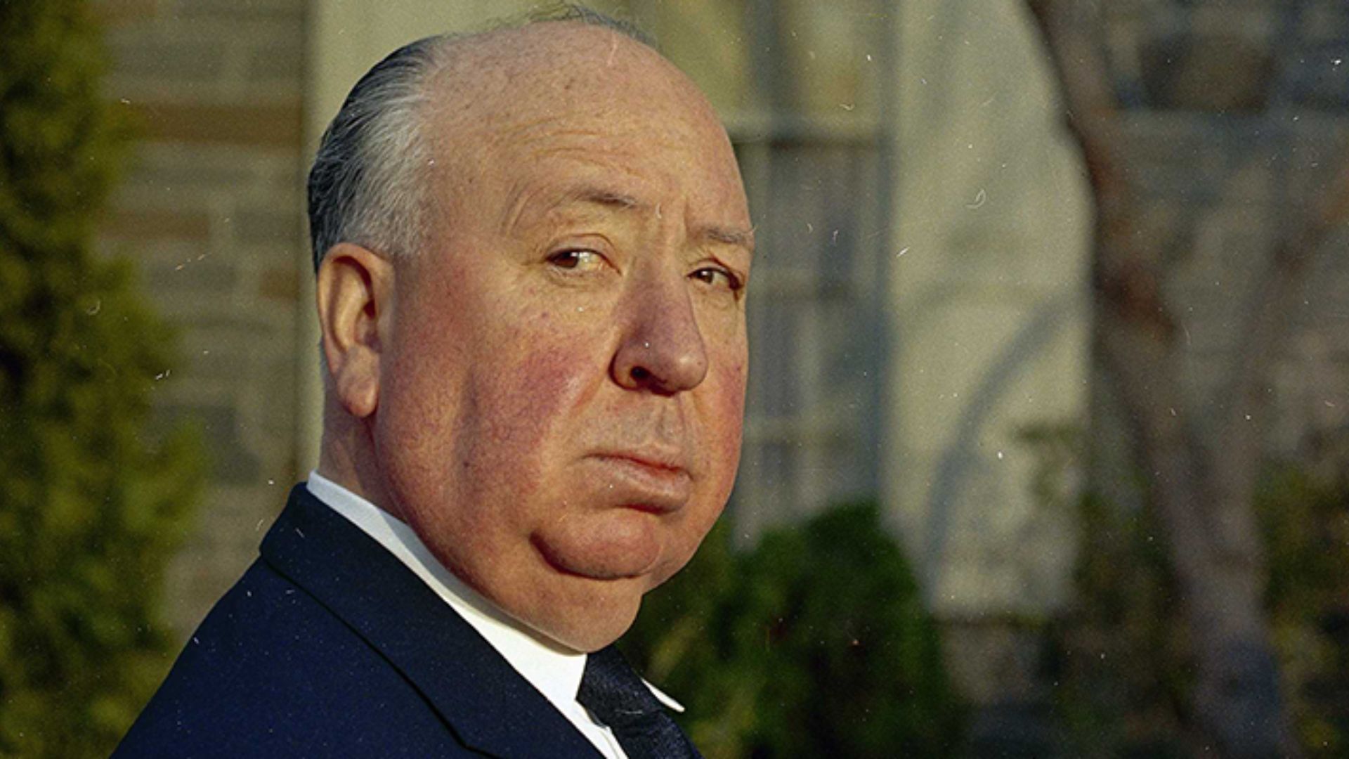 Alfred Hitchcock Wearing A Blue Suit