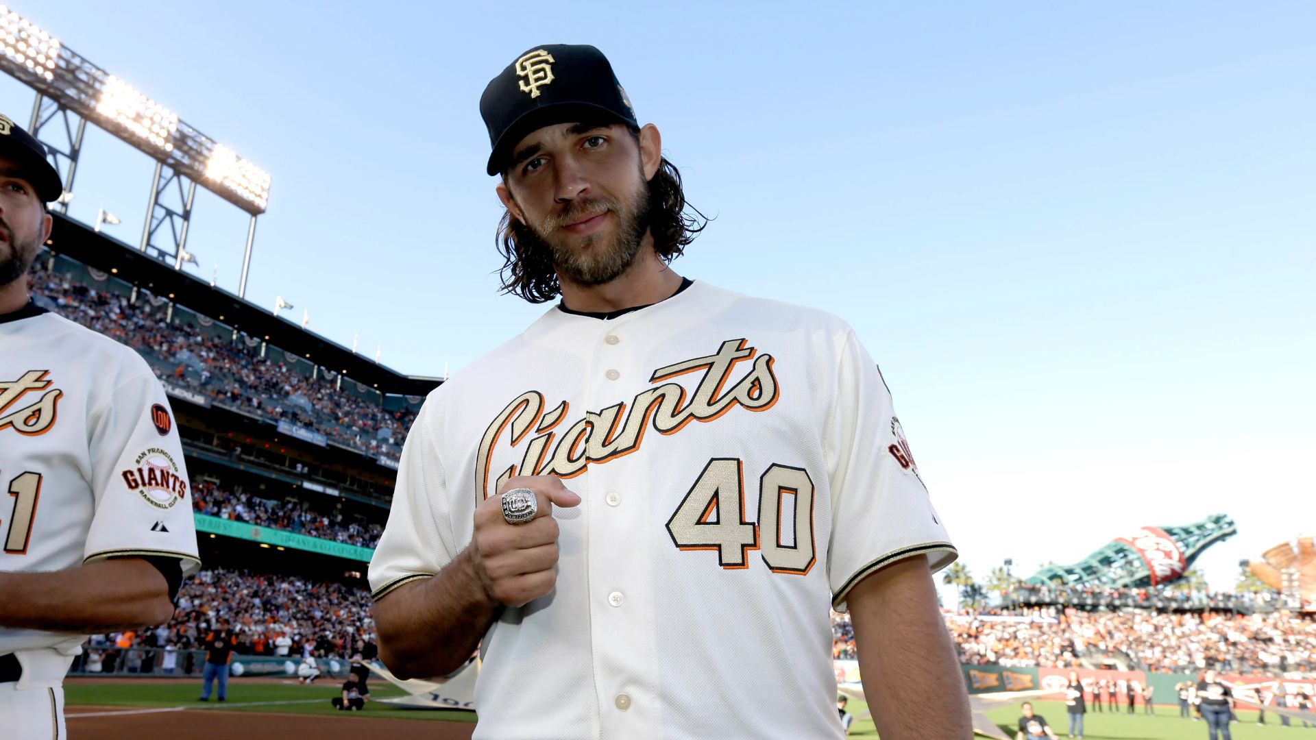 Madison Bumgarner wearing a cap along with his Giants uniform.