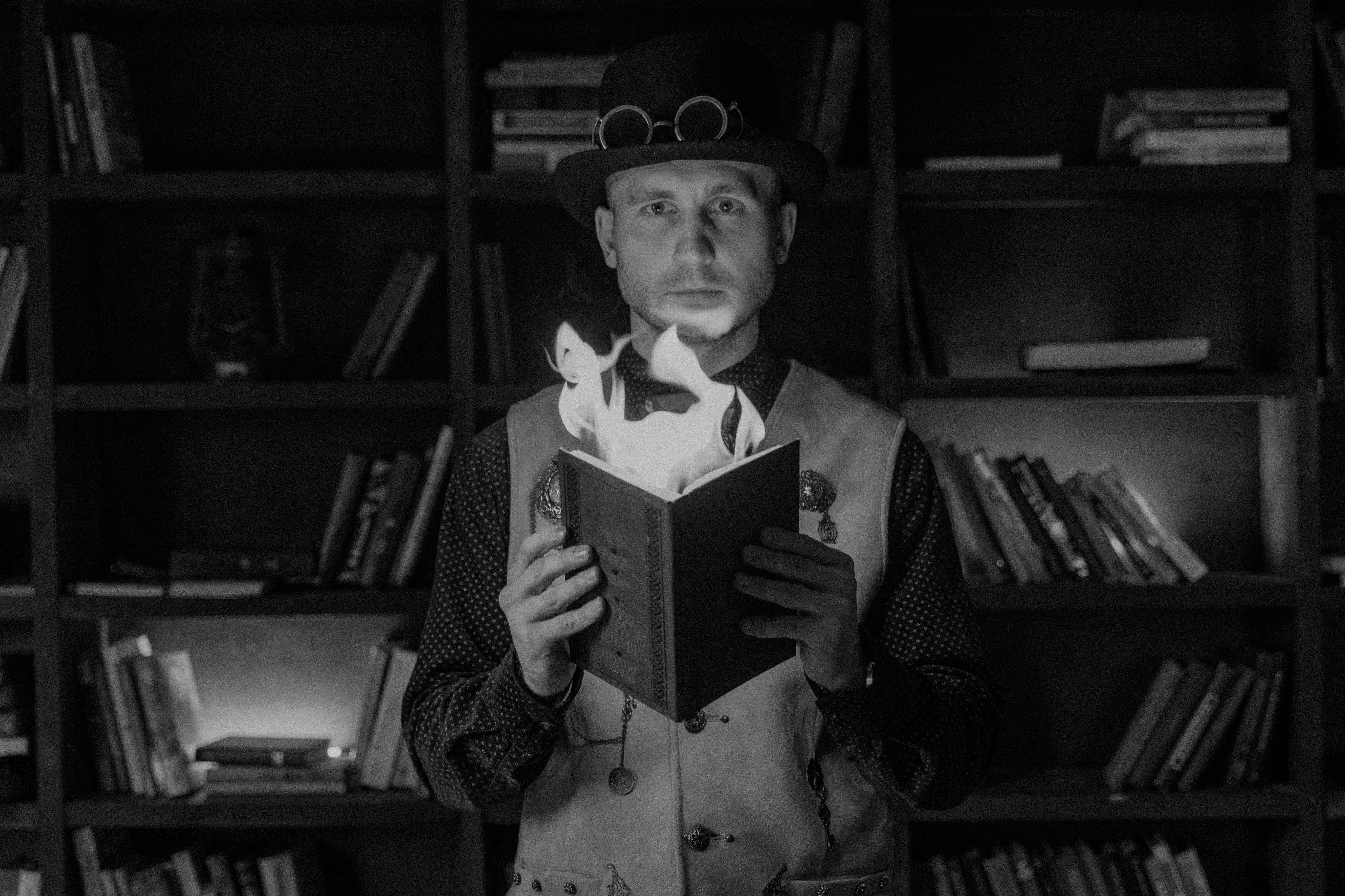An Illusionist holding a burning book.