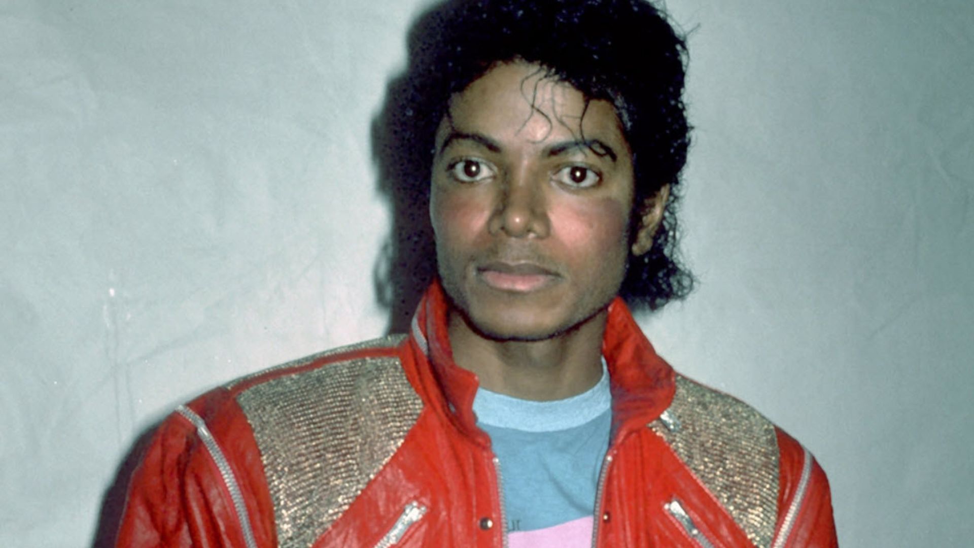 Michael Jackson Wearing An Orange Jacket