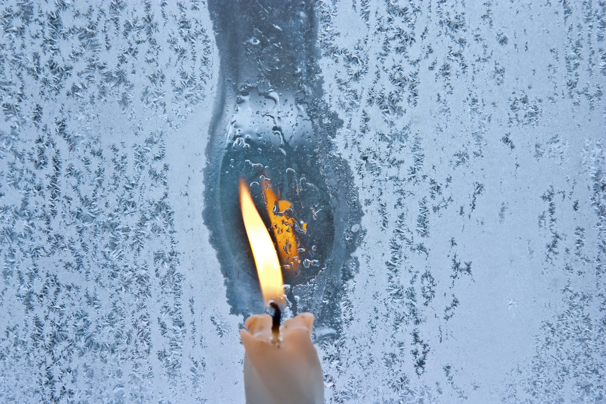 Fire On Candle Melting The Ice