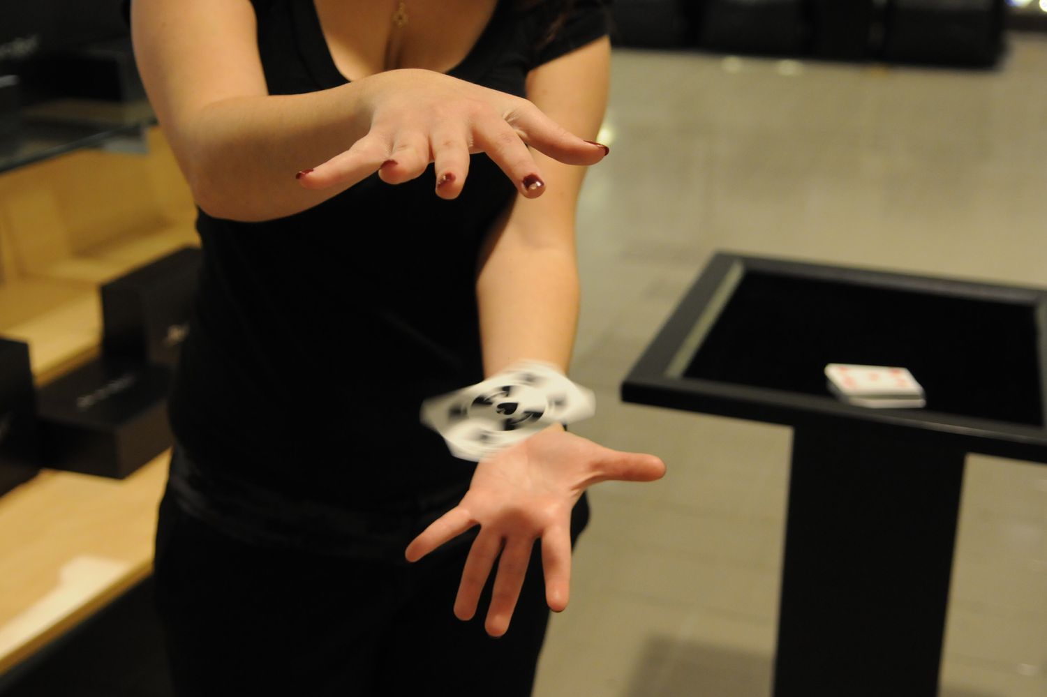A Woman Doing Card Magic Trick