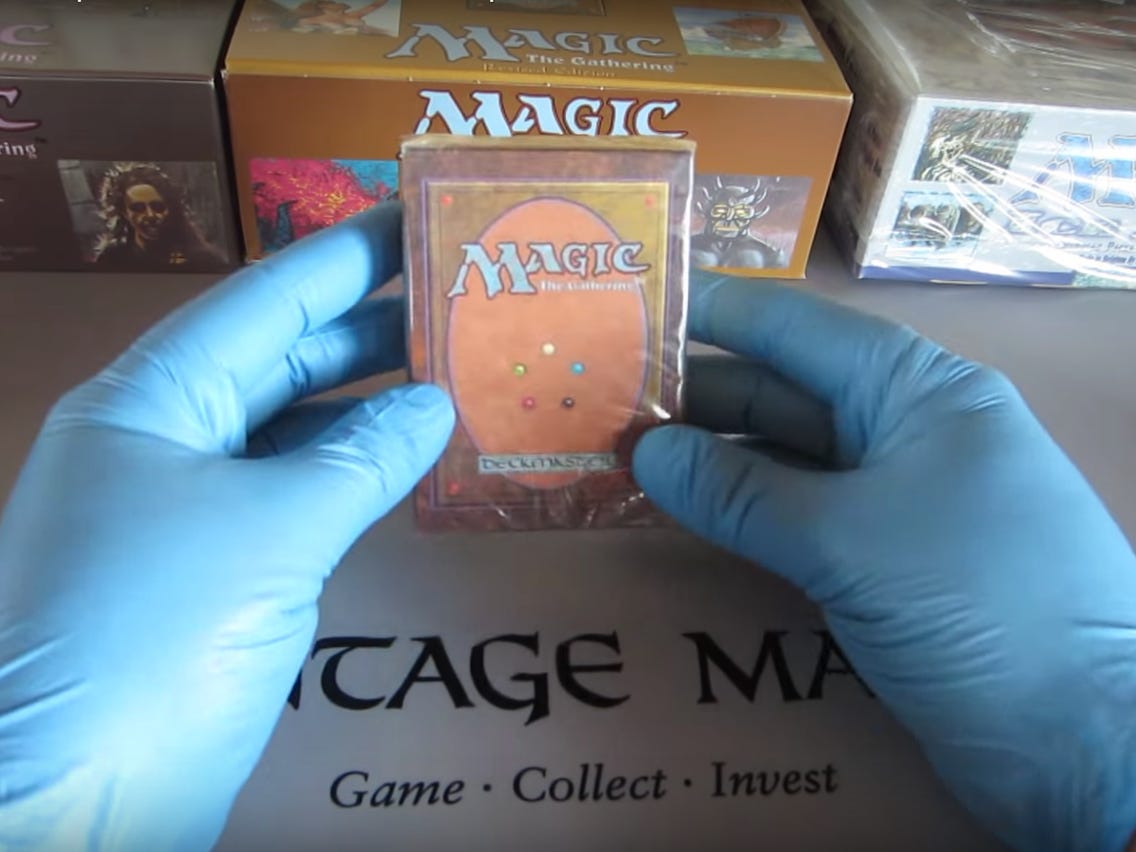 Man Holding A Pack Of Magic Cards