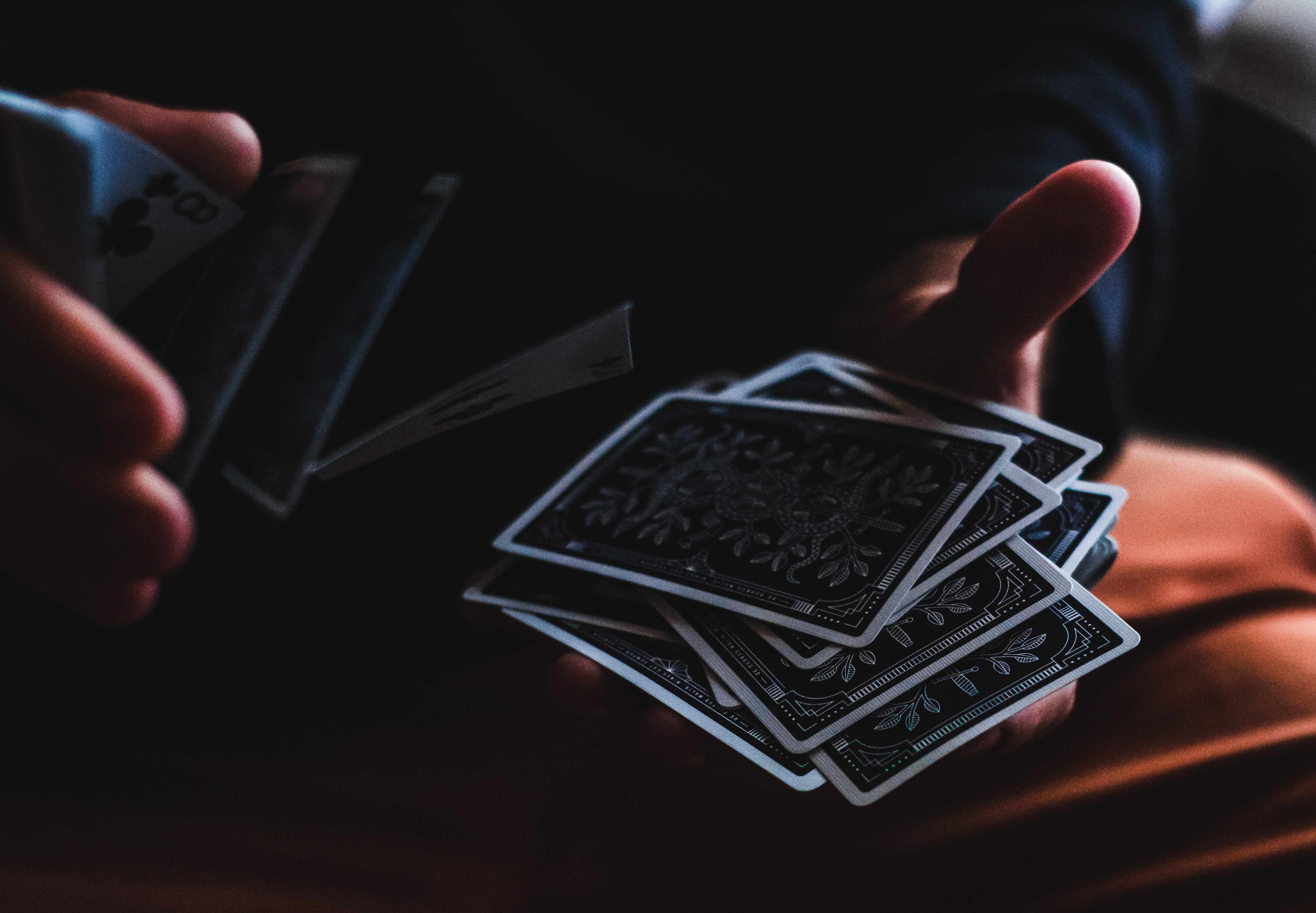 Someone Holding Black Color Playing Card