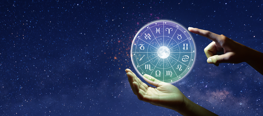 Astrological zodiac signs inside a horoscope circle.