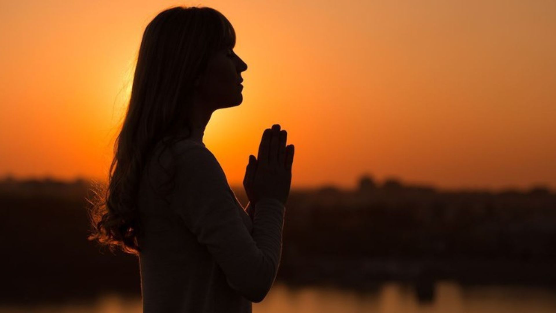 A Woman Praying At The Time Of Sunset