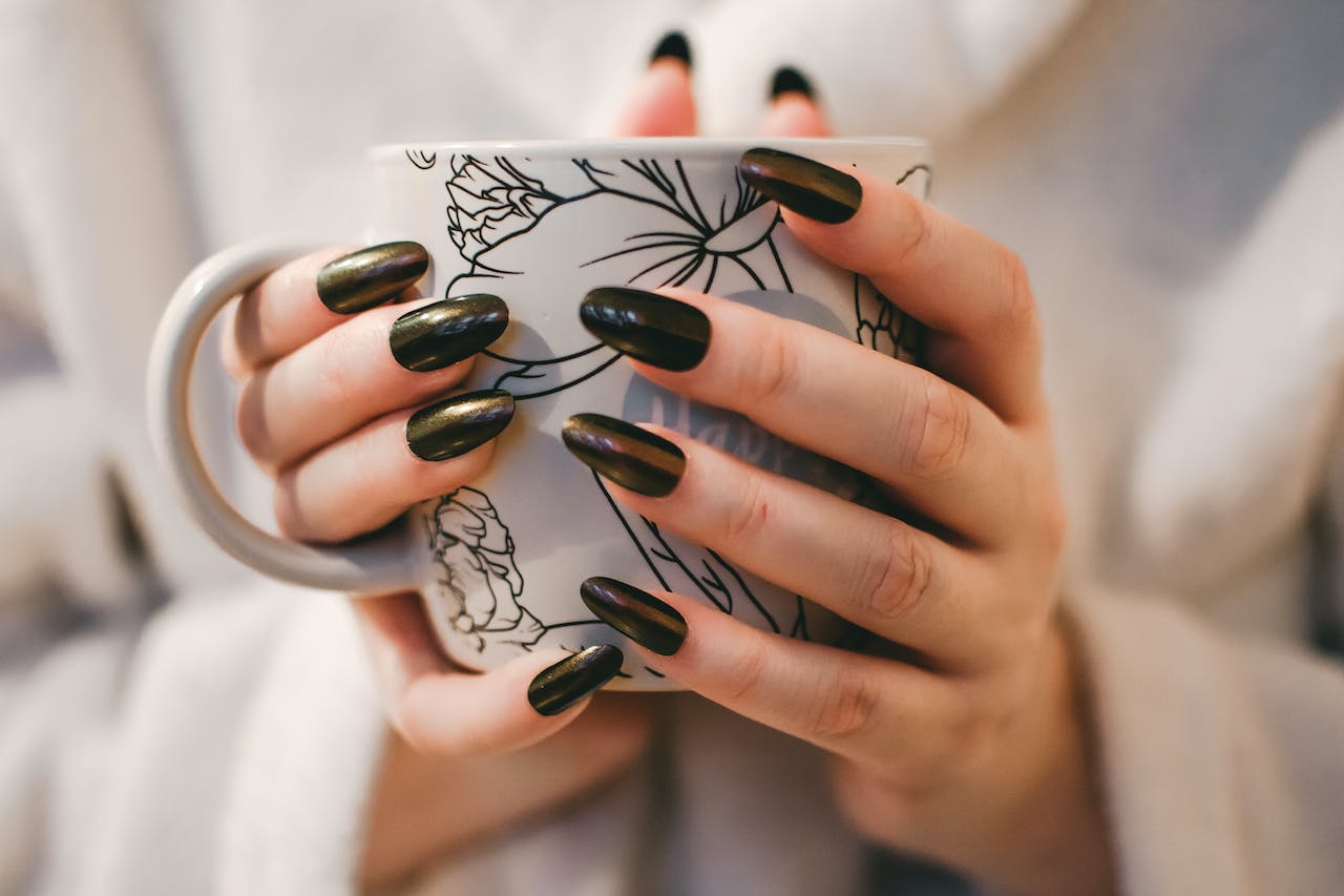 Woman With Black Manicure