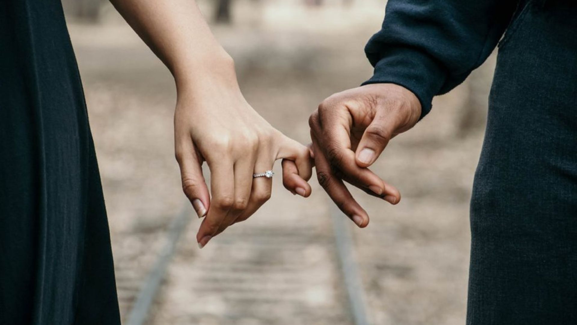 Couple Holding Their Hands With Finger