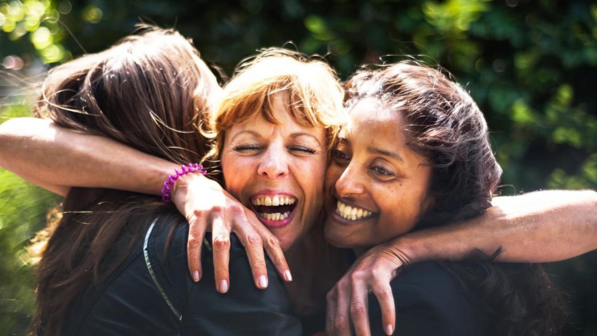 Three Woman Hugging Each Other