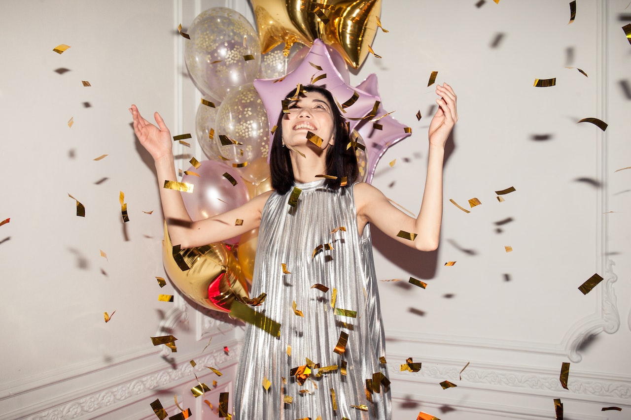 Woman Looking at Falling Confetti On her Birthday