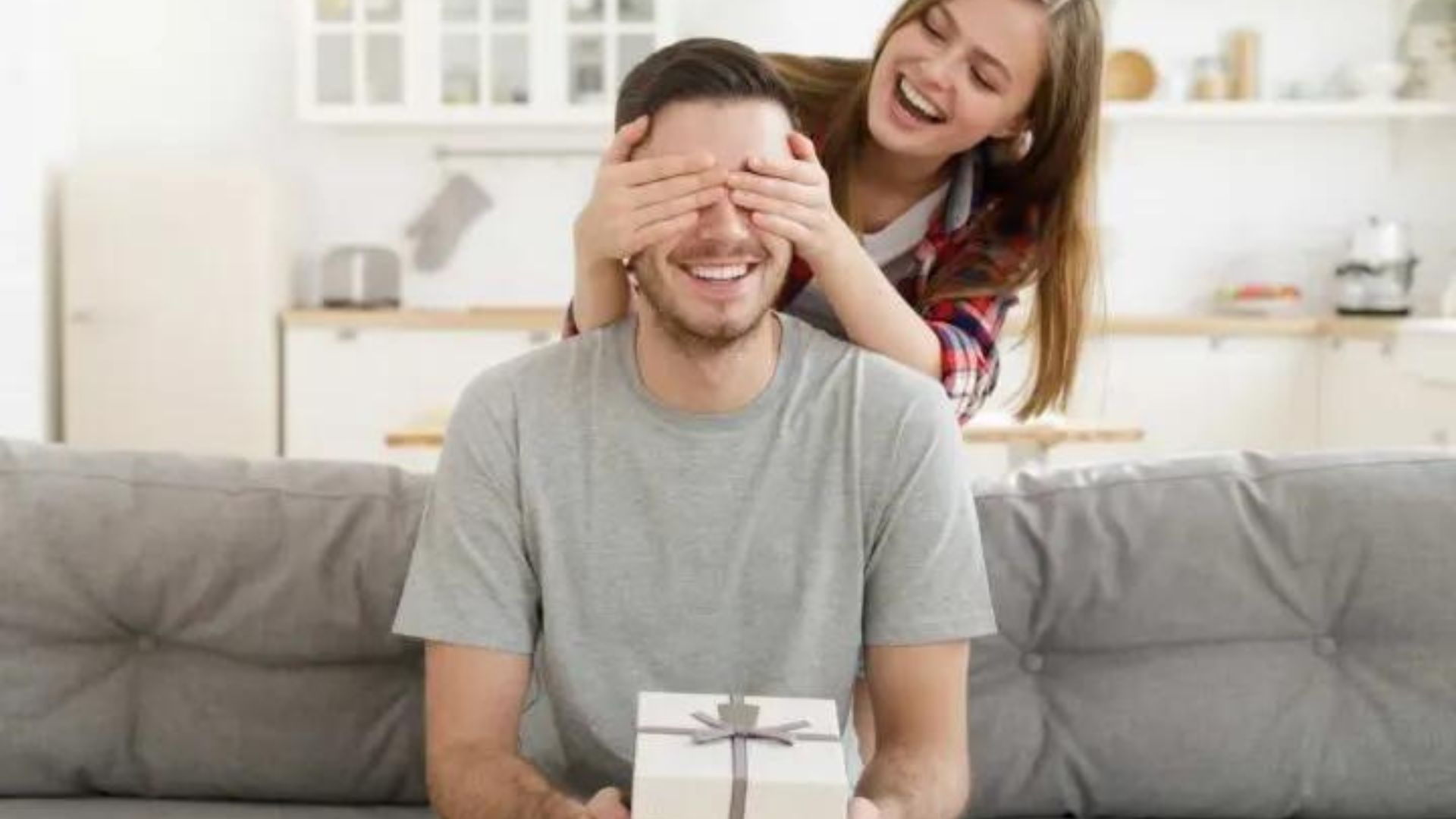 A Wife Giving Birthday Gift To Her Husband