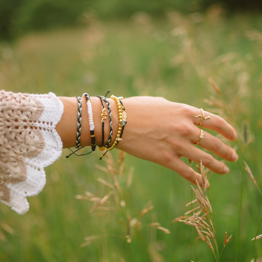 Woman In Field Wearing Beautiful Bracelets