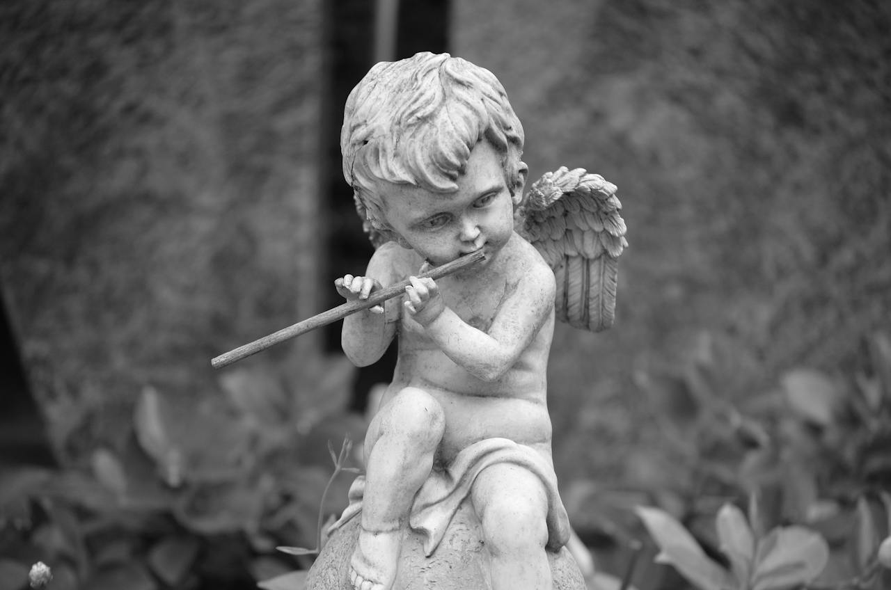 Angel Statue Playing a Flute