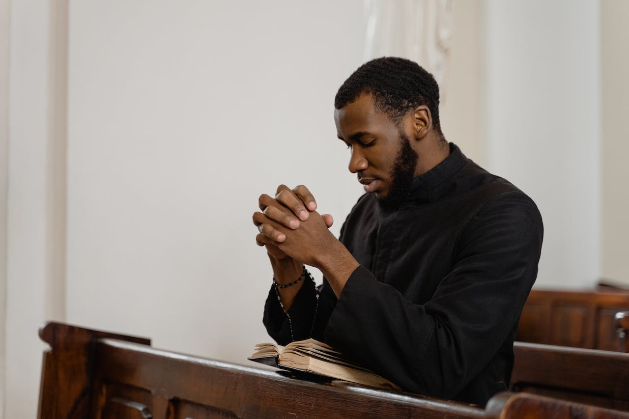 A Religious Man Praying Solemnly