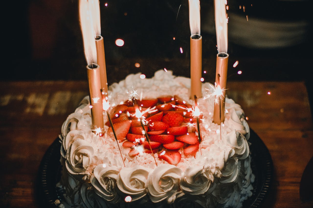 Lighted Candles on an Elegant Looking Cake