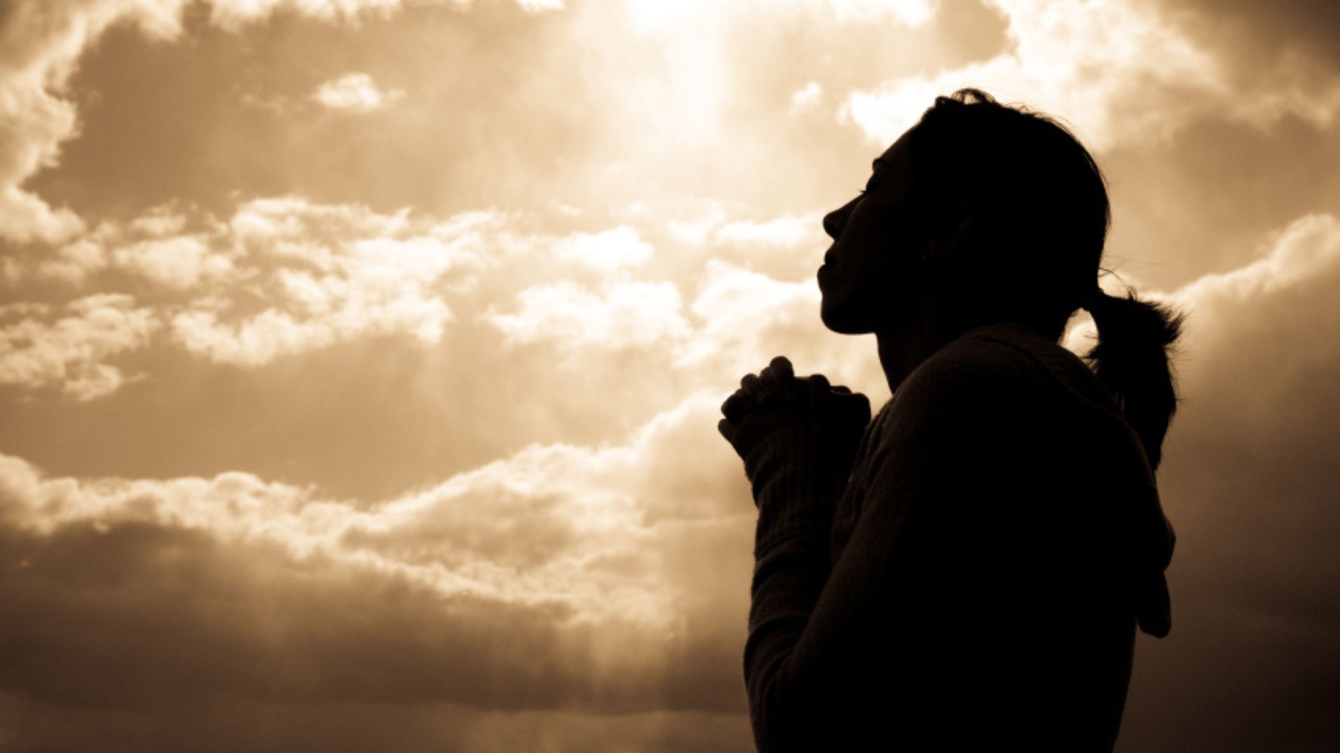 A Woman Praying Under The Open Sky