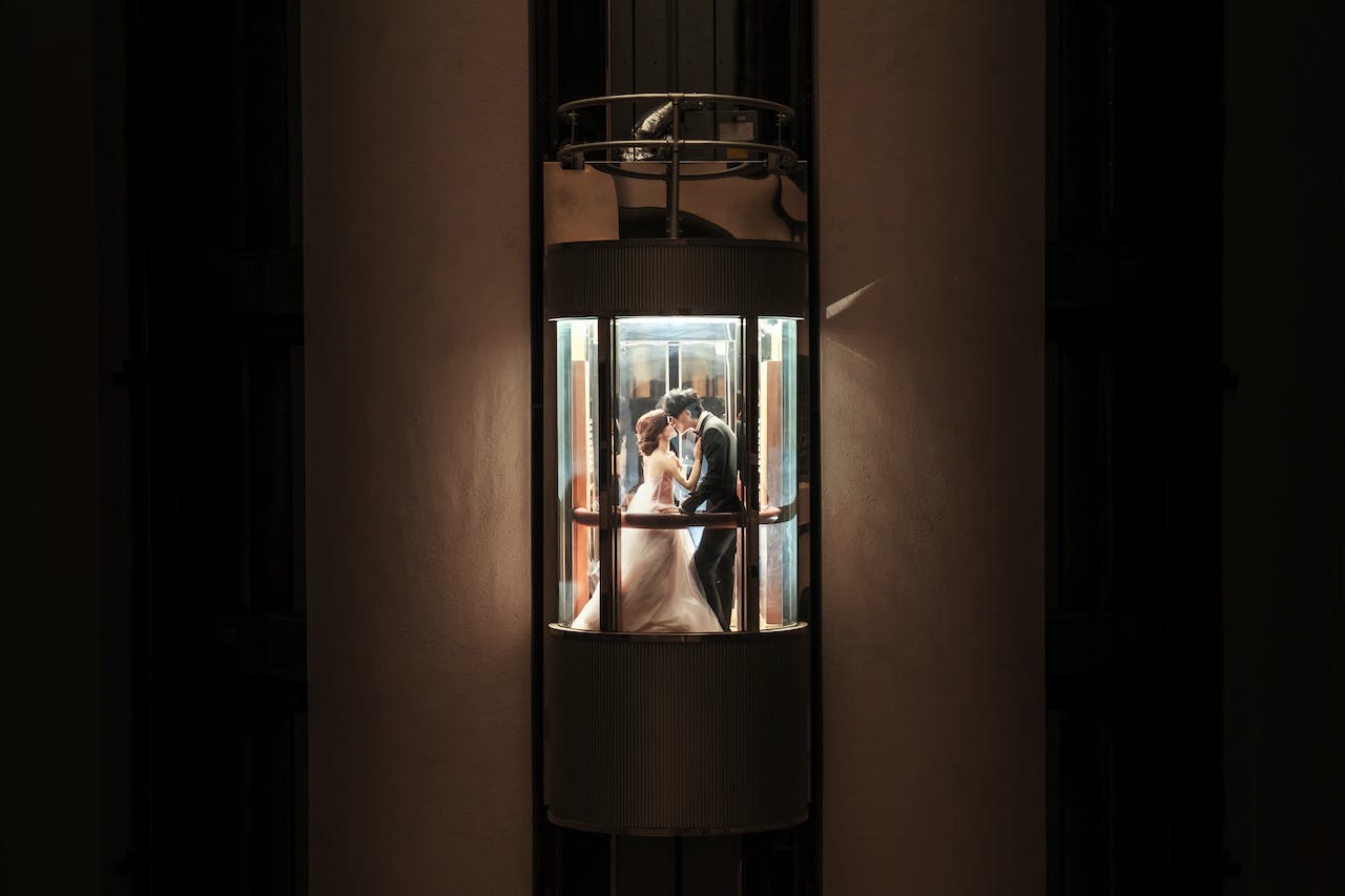 Newlyweds Kissing in an Elevator