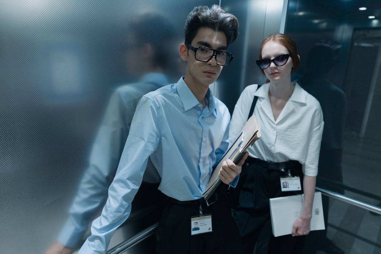 A Man and Woman Inside the Elevator