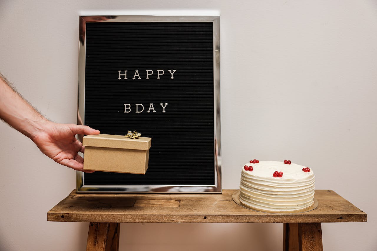 Marquee Board near a a Birthday Cake
